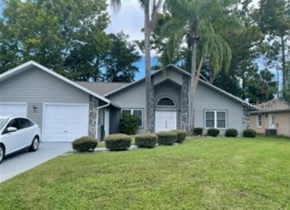 Enter this 3/2 split plan home through double doors into great - Beach Home for sale in Palm Coast, Florida on Beachhouse.com
