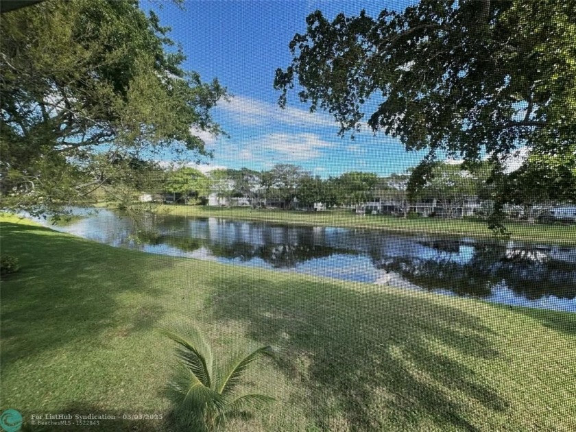 RARE CORNER with a beautiful VIEW OF THE LAKE! This bright - Beach Condo for sale in Deerfield Beach, Florida on Beachhouse.com