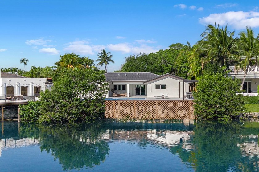 Nestled within the prestigious guard-gated community of - Beach Home for sale in Miami, Florida on Beachhouse.com