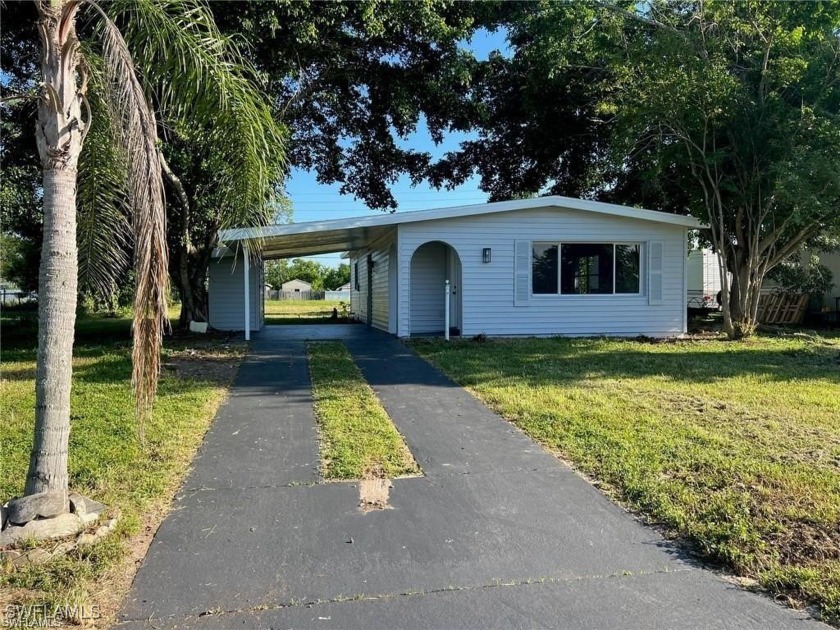 Discover this beautifully updated 2-bedroom, 1-bathroom concrete - Beach Home for sale in Lehigh Acres, Florida on Beachhouse.com