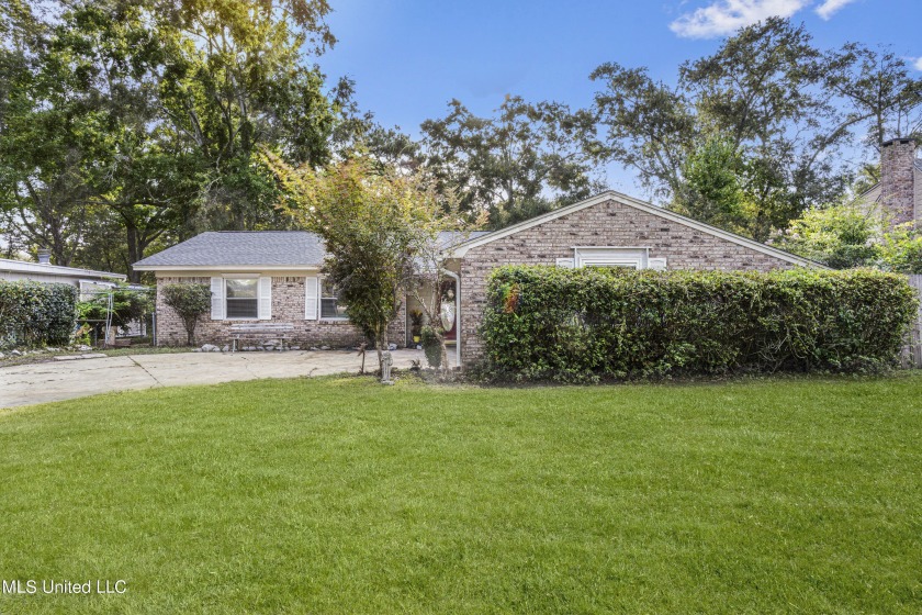 Welcome to this charming home nestled in the heart of Ocean - Beach Home for sale in Ocean Springs, Mississippi on Beachhouse.com