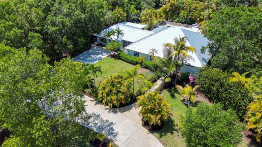 Set on a sprawling 1.9-acre lot backing up to a serene nature - Beach Home for sale in Palm Beach Gardens, Florida on Beachhouse.com