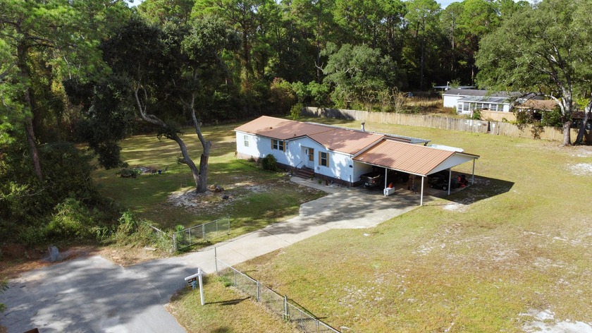 Situated on just under an acre of land! This beautifully - Beach Home for sale in Navarre, Florida on Beachhouse.com