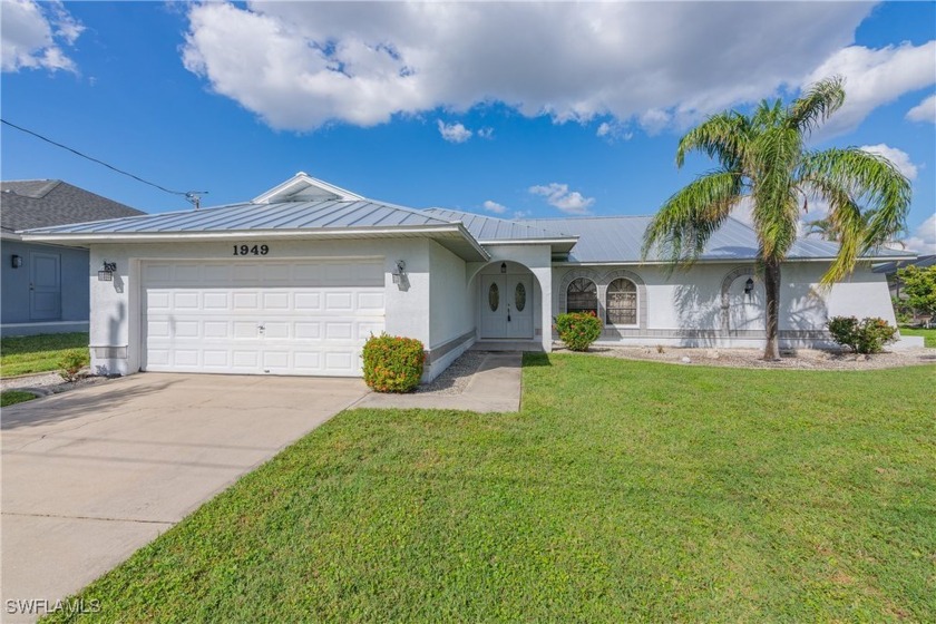 Enjoy waterfront living at its finest with this beautiful Cape - Beach Home for sale in Cape Coral, Florida on Beachhouse.com