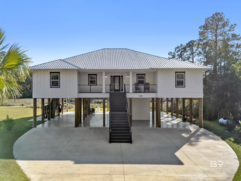 WATERFRONT living meets thoughtful design in this GOLD FORTIFIED - Beach Home for sale in Elberta, Alabama on Beachhouse.com