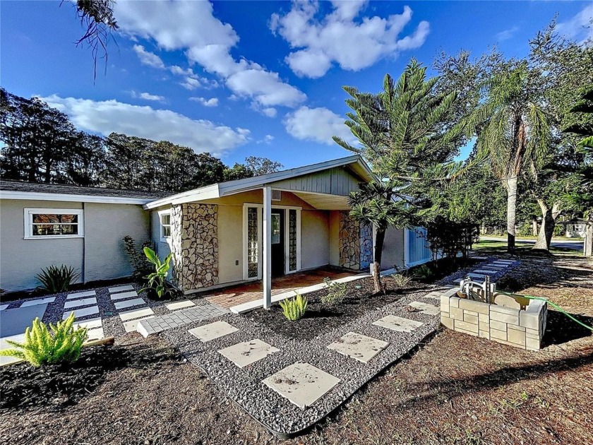 Welcome to 8531 Bass Lake Drive, an exquisitely remodeled - Beach Home for sale in New Port Richey, Florida on Beachhouse.com