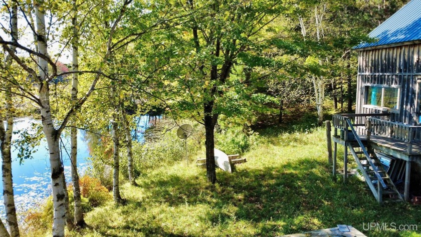 Rustic Pondside Cabin in the Woods. Tucked beneath tall pines - Beach Home for sale in Calumet, Michigan on Beachhouse.com