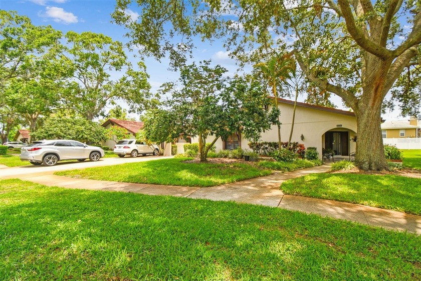 This lovely villa is located in the highly desirable East Lake - Beach Home for sale in Palm Harbor, Florida on Beachhouse.com