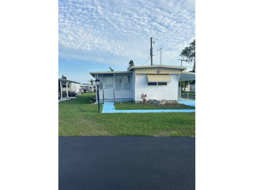 This charming corner lot home offers a stunning view of the lake - Beach Home for sale in South Daytona, Florida on Beachhouse.com