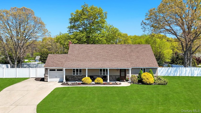 Welcome to this beautifully expanded dormered Cape situated on - Beach Home for sale in Miller Place, New York on Beachhouse.com