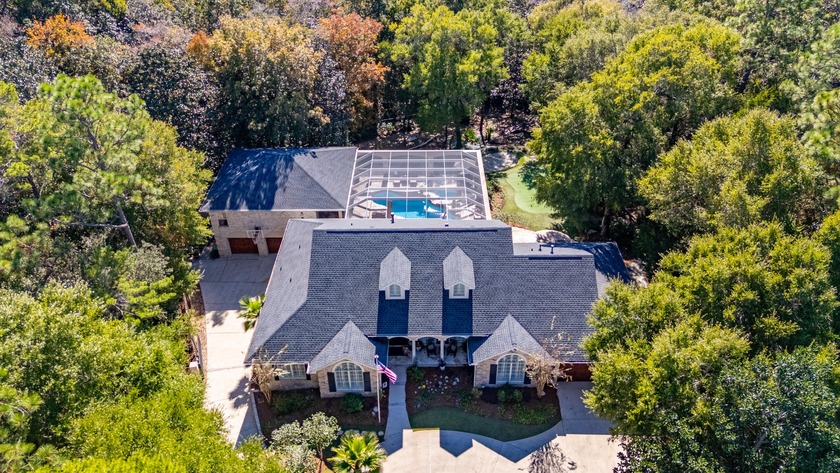 Nestled on over an acre of lush, tree-lined land in the sought - Beach Home for sale in Niceville, Florida on Beachhouse.com