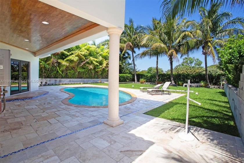 Located on a private gated island in Miami Beach, this residence - Beach Home for sale in Miami Beach, Florida on Beachhouse.com