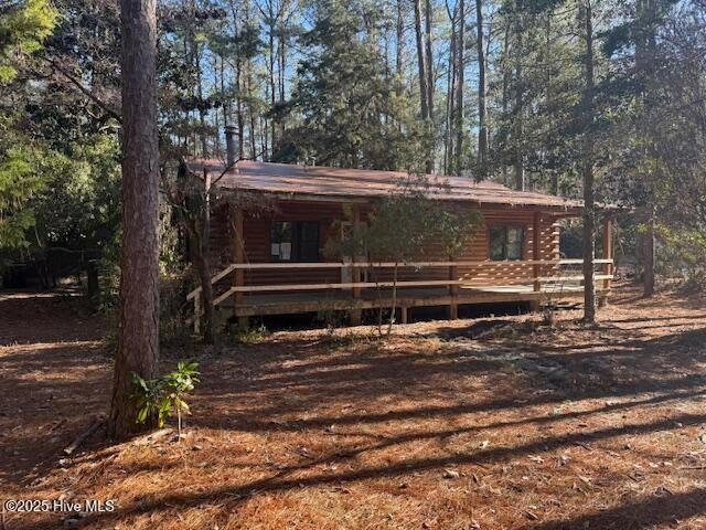 Two bedroom, one bath log home situated on .62 acres surrounded - Beach Home for sale in Arapahoe, North Carolina on Beachhouse.com