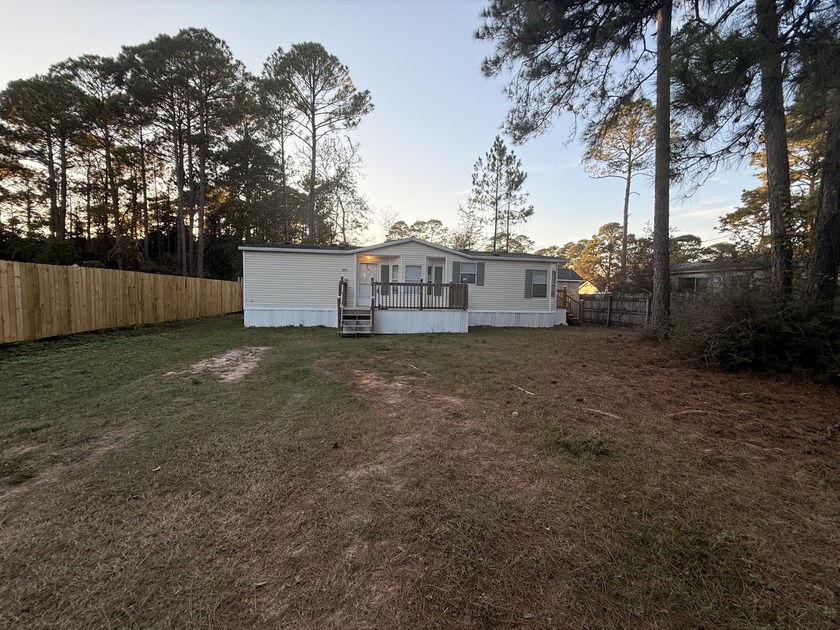 This charming coastal retreat that blends comfort, convenience - Beach Home for sale in Mary Esther, Florida on Beachhouse.com