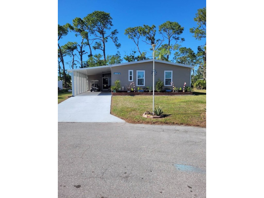 This home is situated on a quiet cul-de-sac in the Lake Fairways - Beach Home for sale in North Fort Myers, Florida on Beachhouse.com