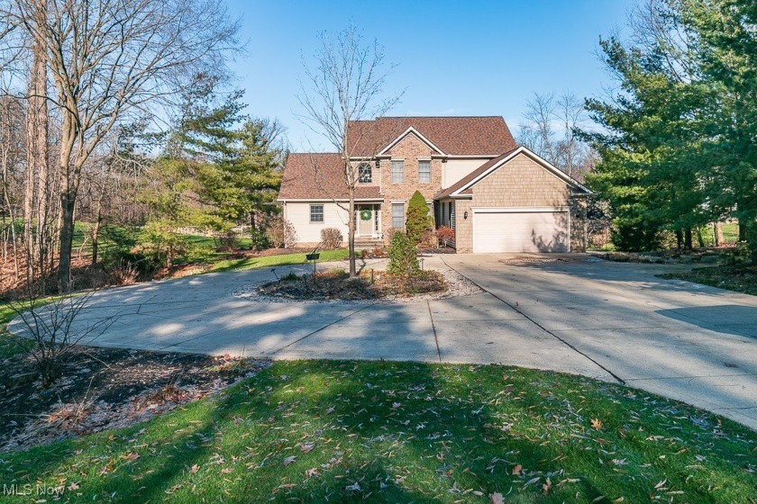 Nestled on over 2.5 acres of lush landscaping, vibrant - Beach Home for sale in Willoughby Hills, Ohio on Beachhouse.com