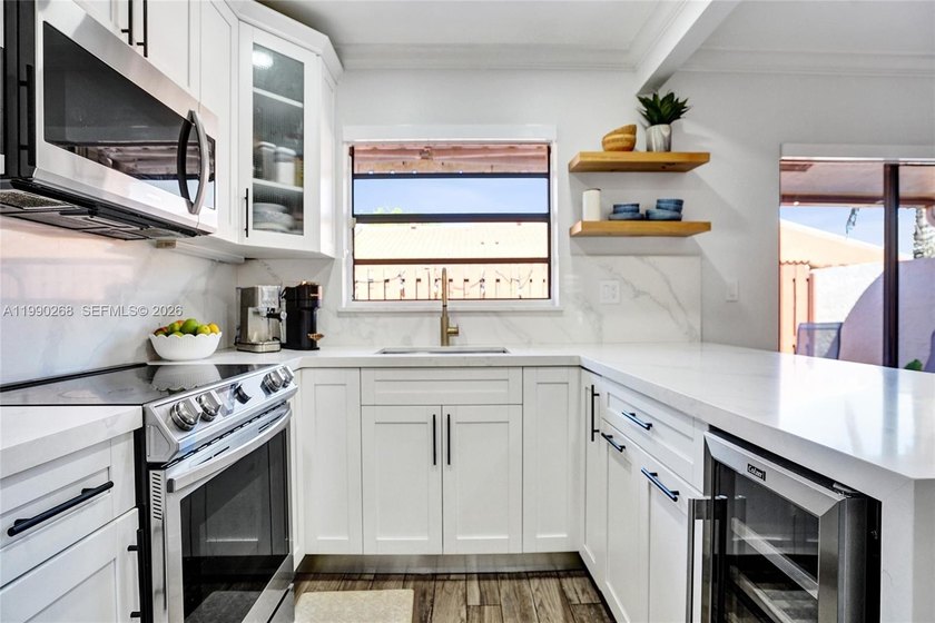 GORGEOUS ONE STORY VILLA W/2 BD, 2 BATHS, & DEN (EASY 3RD BDRM - Beach Home for sale in Cooper City, Florida on Beachhouse.com