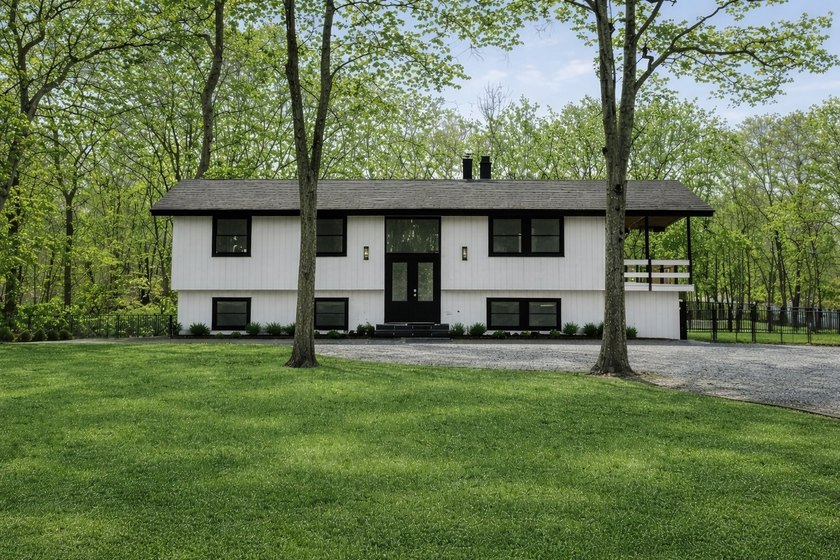 Tucked away on a full acre in the heart of Hampton Bays, this - Beach Home for sale in Hampton Bays, New York on Beachhouse.com