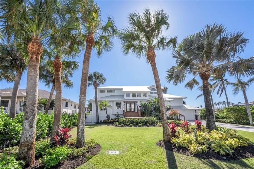 This stunning 2 Level home, elevated home is situated on a - Beach Home for sale in Naples, Florida on Beachhouse.com