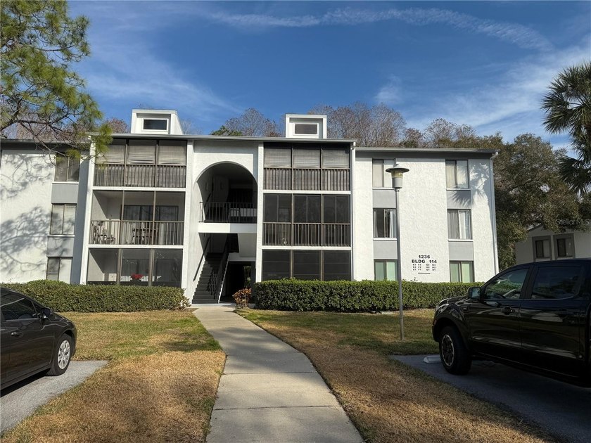 This 2-bedroom, 2-bathroom condo features a screened porch with - Beach Condo for sale in Tarpon Springs, Florida on Beachhouse.com