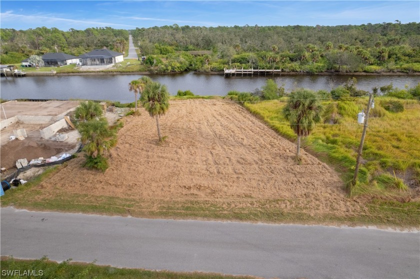 Nestled along the tranquil shores of the Apollo Waterway, a - Beach Lot for sale in Port Charlotte, Florida on Beachhouse.com