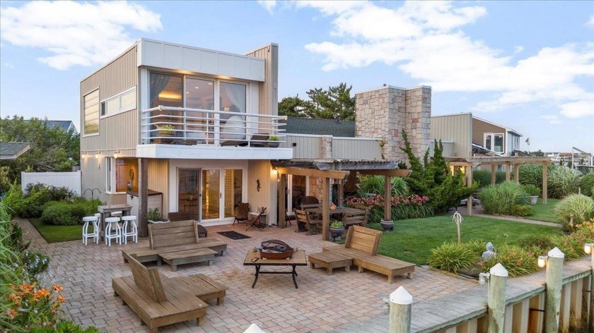 Experience modern waterfront living at its finest in this - Beach Home for sale in Copiague, New York on Beachhouse.com