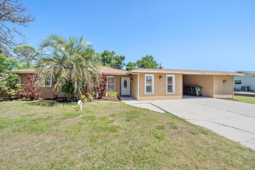 Location, location, location! This 3-bedroom, 2-bath home with a - Beach Home for sale in Sarasota, Florida on Beachhouse.com