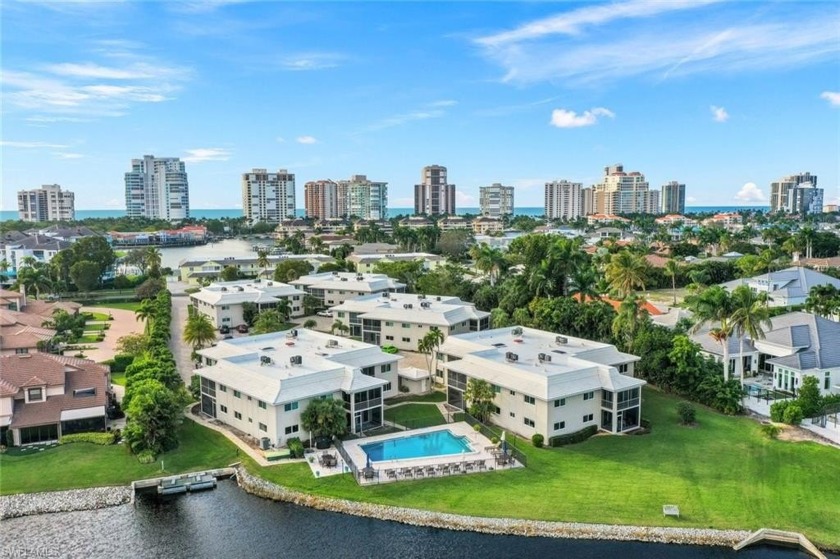 Experience unparalleled lakefront living in this Parkshore condo - Beach Home for sale in Naples, Florida on Beachhouse.com