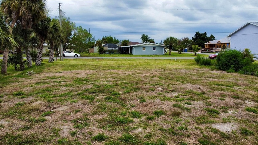 This vacant spring-fed pond lot, located in Aqui Esta, is - Beach Lot for sale in Punta Gorda, Florida on Beachhouse.com