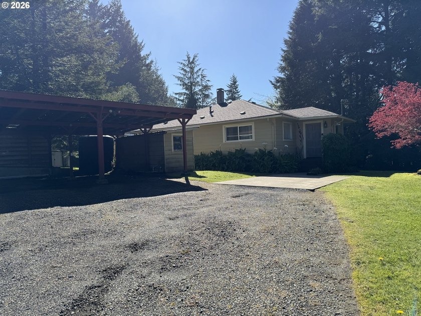 Tucked away in a peaceful, private setting, this charming - Beach Home for sale in Coos Bay, Oregon on Beachhouse.com