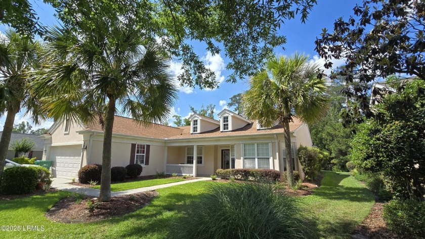 As you arrive, a covered front porch invites you into this - Beach Home for sale in Bluffton, South Carolina on Beachhouse.com
