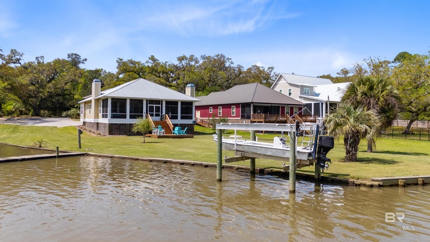 Welcome to this stunning custom-built waterfront home, offering - Beach Home for sale in Gulf Shores, Alabama on Beachhouse.com