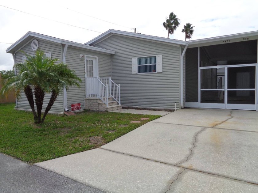THIS LOVELY 2004 PALM HARBOR HOME SITS ON A QUIET DEAD END - Beach Home for sale in New Port Richey, Florida on Beachhouse.com