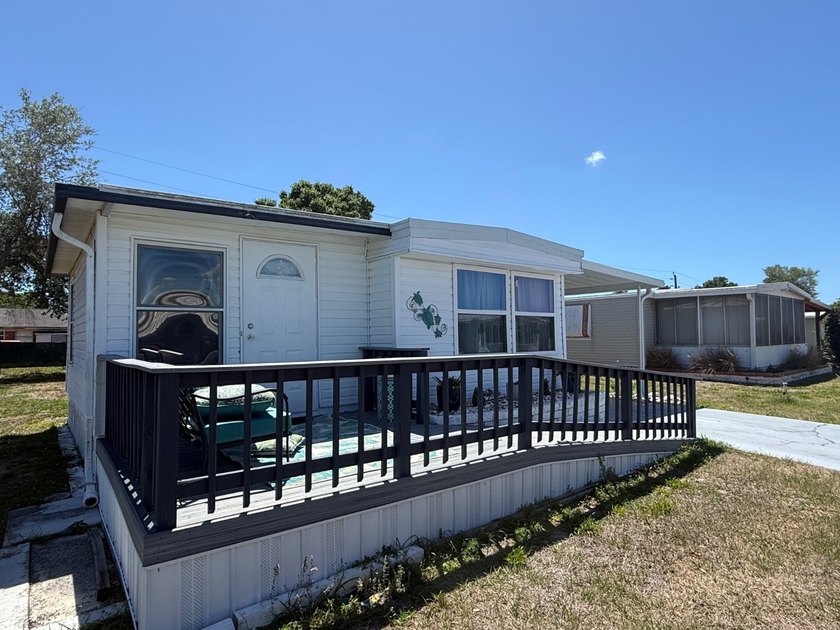 Tucked into a quiet 55+ community just minutes from the Gulf - Beach Home for sale in Bradenton, Florida on Beachhouse.com