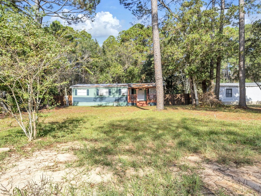 Turnkey coastal investment opportunity near Navarre Beach. This - Beach Home for sale in Navarre, Florida on Beachhouse.com