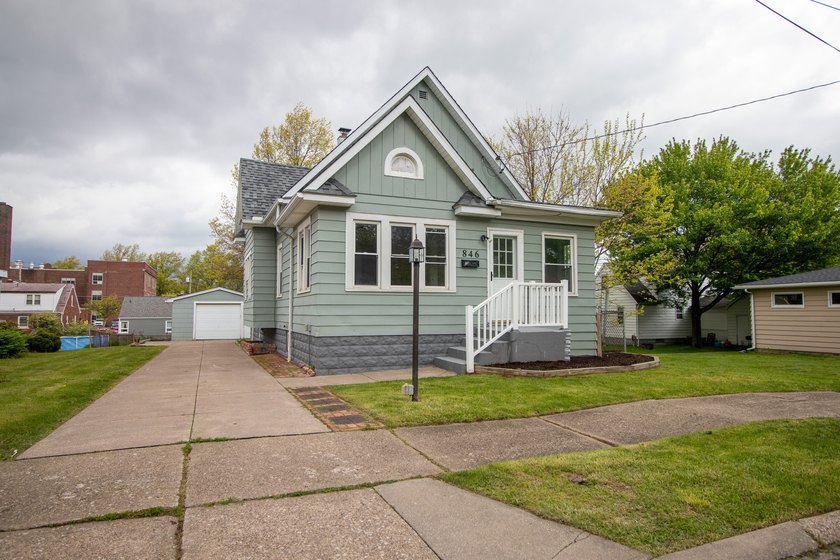 This spacious 4 bedroom, 2 full bath home is full of charm and - Beach Home for sale in Erie, Pennsylvania on Beachhouse.com