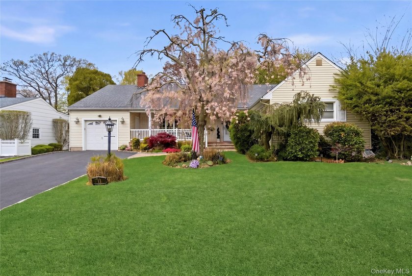 Nestled on a lovely tree-lined street in the highly desirable - Beach Home for sale in Massapequa, New York on Beachhouse.com