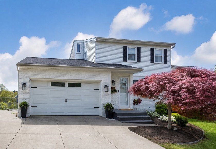 Welcome to this beautifully updated, crisp, white, brick and - Beach Home for sale in Erie, Pennsylvania on Beachhouse.com