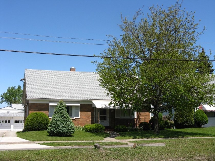 This solid brick ranch right across the street from Mercyhurst - Beach Home for sale in Erie, Pennsylvania on Beachhouse.com