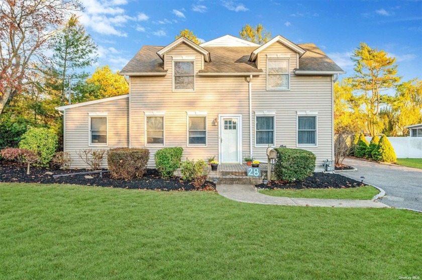 Welcome home to this beautiful center hall colonial on a - Beach Home for sale in Oakdale, New York on Beachhouse.com