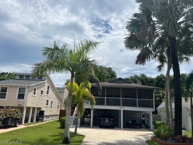 Charming, 3 Bedroom 2 Bath Stilt Home situated in the center of - Beach Home for sale in Bonita Springs, Florida on Beachhouse.com