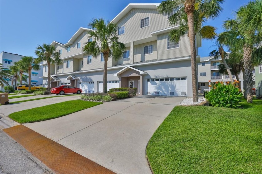 Experience the best of coastal living in this rare 4-bedroom, 3 - Beach Townhome/Townhouse for sale in Madeira Beach, Florida on Beachhouse.com