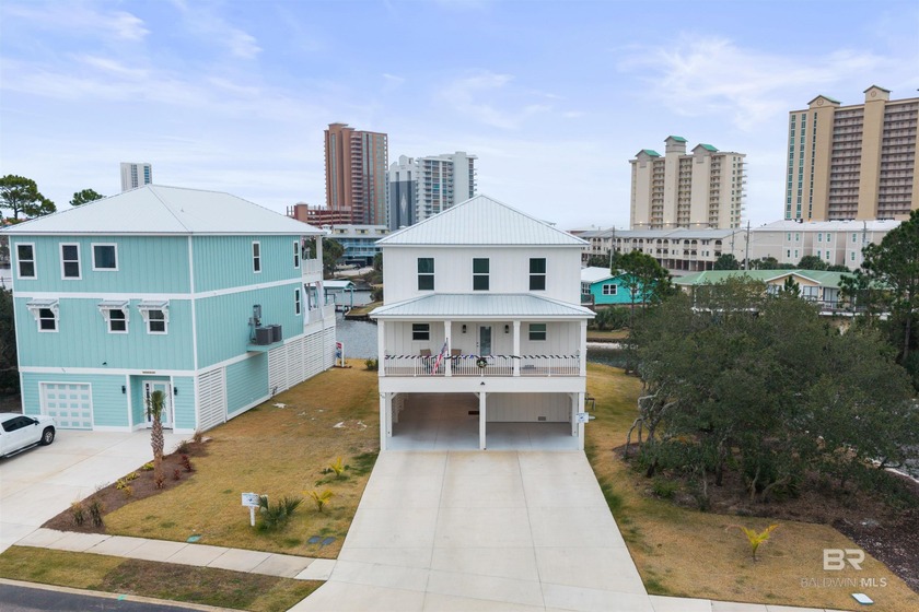 Coastal living forward and impeccably appointed, this residence - Beach Home for sale in Gulf Shores, Alabama on Beachhouse.com