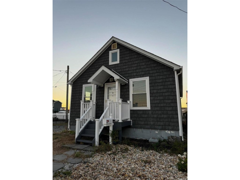 A boaters dream location! This updated cape is one house off the - Beach Home for sale in Lindenhurst, New York on Beachhouse.com