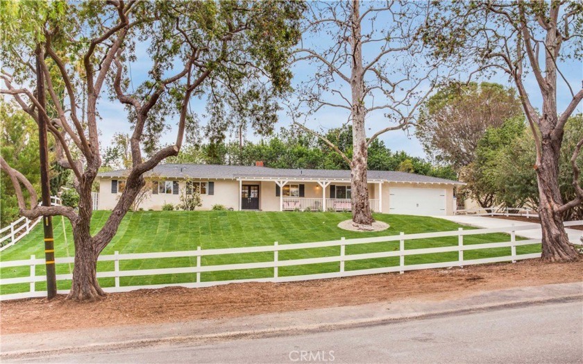 Set back off the street, on a sprawling blanket of grass, sits - Beach Home for sale in Rolling Hills Estates, California on Beachhouse.com