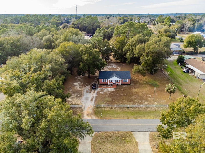Coastal well-maintained brick home situated on a .72-acre level - Beach Home for sale in Lillian, Alabama on Beachhouse.com