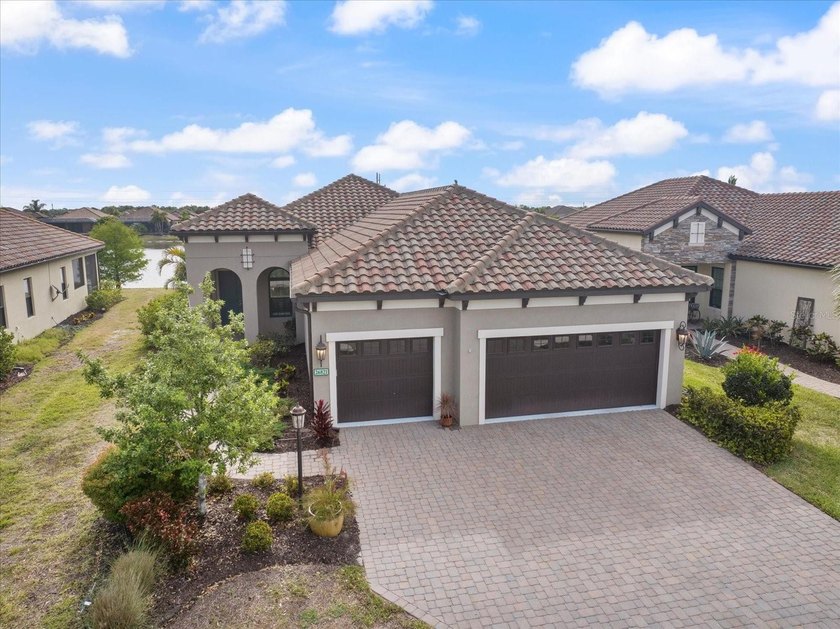 Welcome to 26821 Weiskopf Drive, a stunning lakefront residence - Beach Home for sale in Englewood, Florida on Beachhouse.com