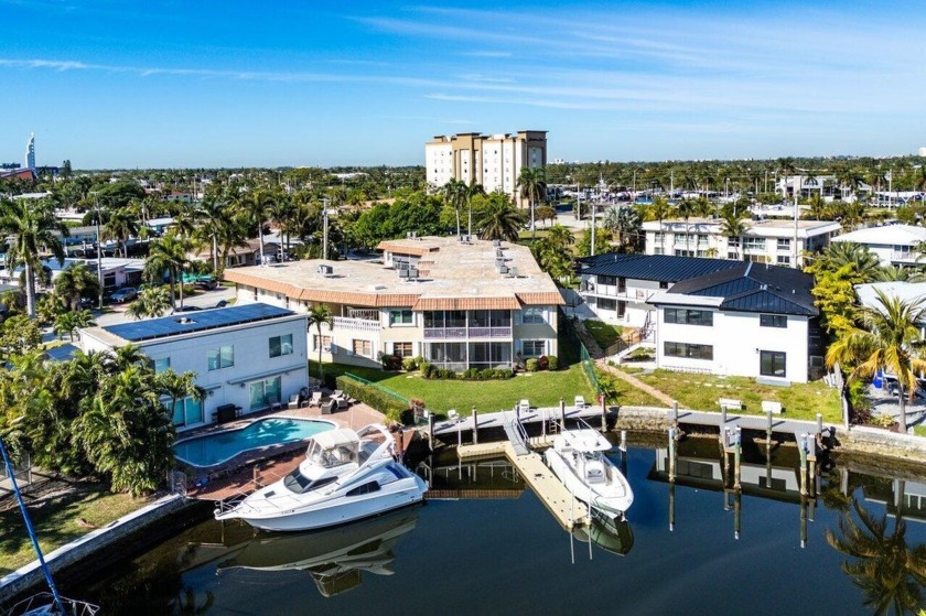 Stunning Corner Unit with Ocean-Access Water Views! This - Beach Condo for sale in Pompano Beach, Florida on Beachhouse.com