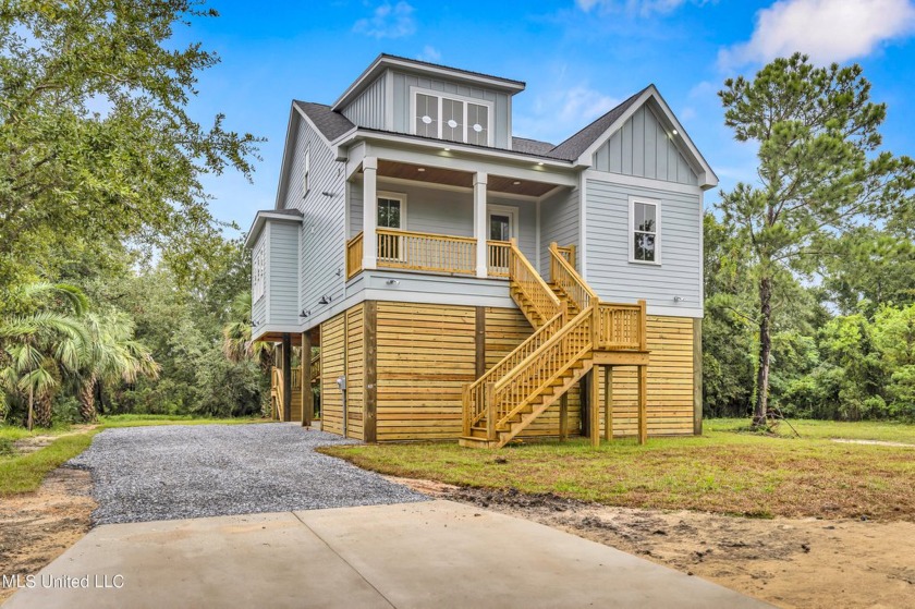 This FORTIFIED GOLD Certified coastal retreat, nestled among the - Beach Home for sale in Pass Christian, Mississippi on Beachhouse.com