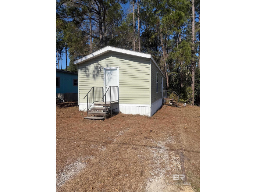 Want to escape the winter weather? Come south to this Quaint - Beach Home for sale in Lillian, Alabama on Beachhouse.com
